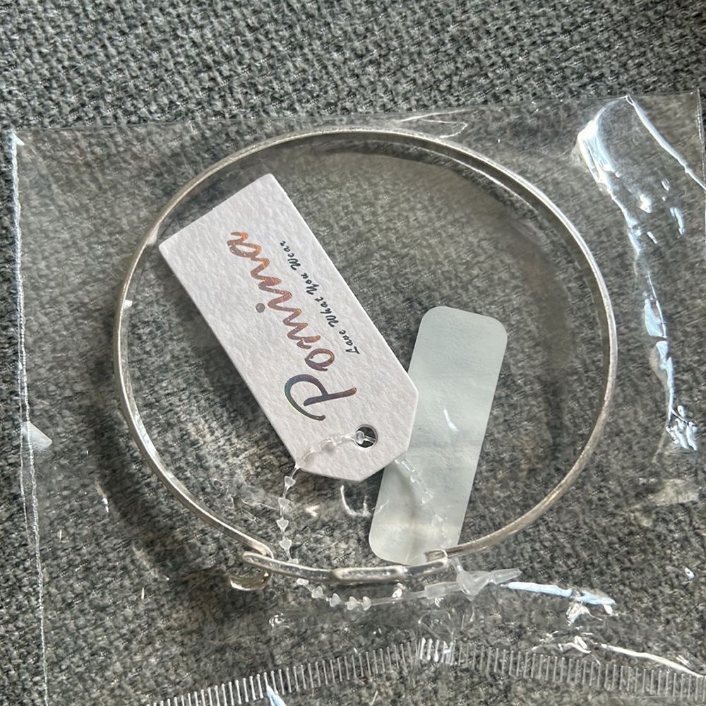 Simple Metal Bangle Bracelet Featuring Cross Charm Closure - Picture 3 of 4